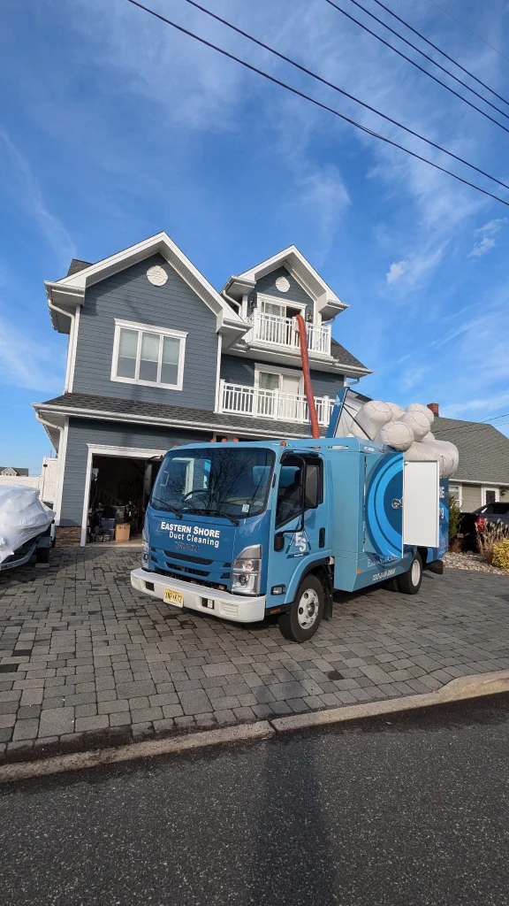 duct cleaning truck at residential home driveway